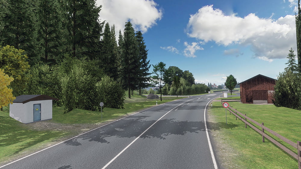 Screenshot from the mobile game Drive Real Truck Simulator: Winding road flanked by dense trees and small structures, showcasing a rural landscape with clear blue skies and white clouds.