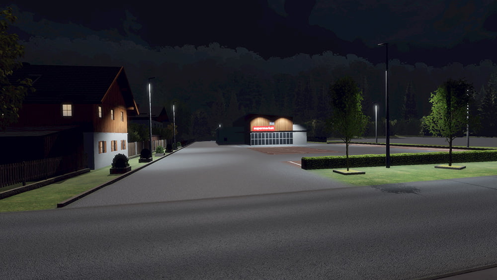 Screenshot from the mobile game Drive Real Truck Simulator: Nighttime view of a small town with a supermarket, street lights illuminating the area, and a few houses against a dark forest backdrop.